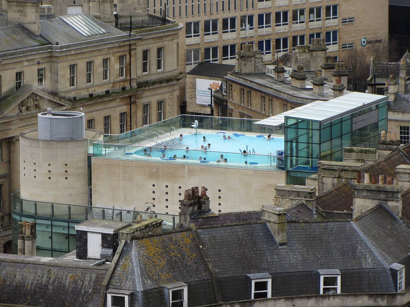The modern glass Thermae Bath Spa building seen from above among Georgian streets